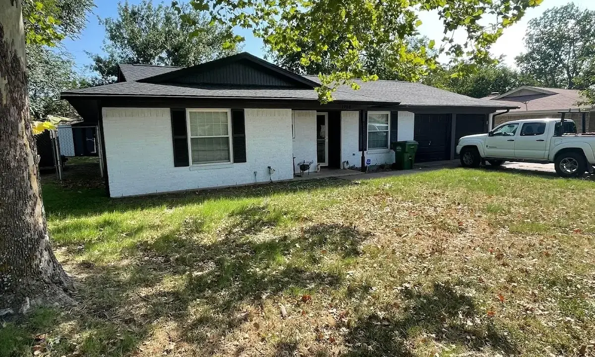 Professional roofing crew working on a residential roof in Hopewell
